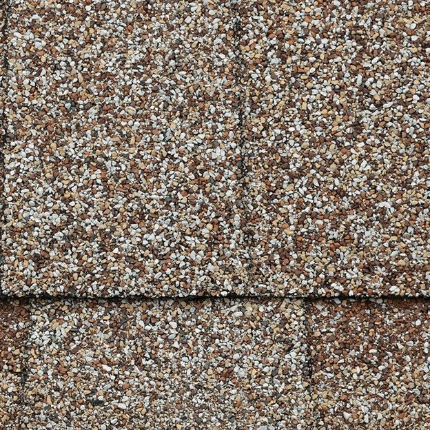 A close up of the roof shingles on a house