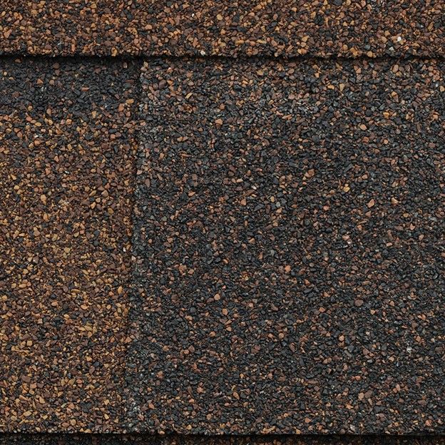 A close up of the asphalt shingles on a house