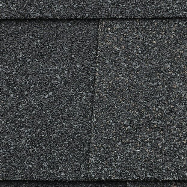 A close up of the asphalt shingles on a roof