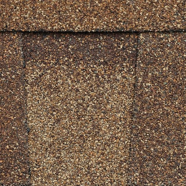 A close up of the roof shingles on a house