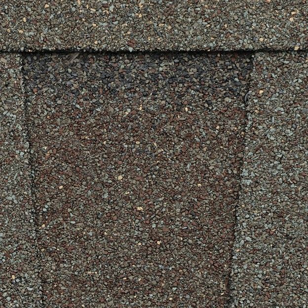 A close up of the roof shingles on a house