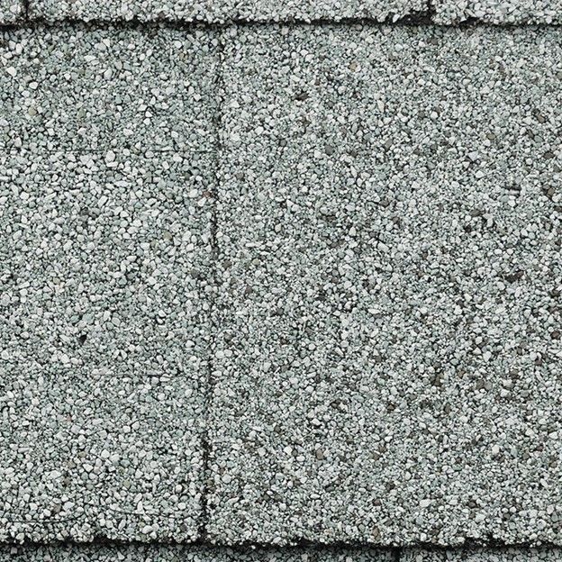 A close up of the asphalt shingles on a roof