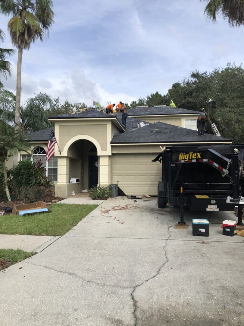 A truck is parked in front of a house.