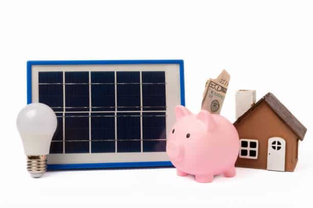 Solar panel, LED, and piggy bank isolated on white background. The concept of saving money and clean energy. Concept of ecology and sustainable development. Solar panel, led lamp, house model, money and piggy bank isolated on white background. The concept of saving money and clean energy. Concept of ecology and sustainable development. Solar Property Tax Exemptio stock pictures, royalty-free photos & images