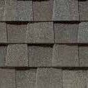 A close up of the roof shingles on this house